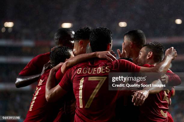 Bruno Fernandes of Portugal celebrates with his team-mates after scoring his team's second goal during the friendly match of preparation for FIFA...