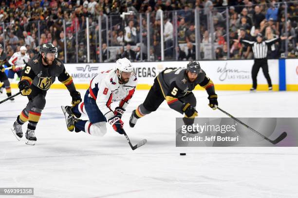 Alex Ovechkin of the Washington Capitals shoots the puck as he falls to the ice during the second period against the Vegas Golden Knights in Game...