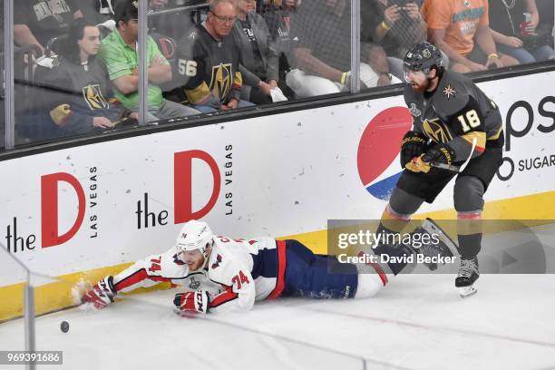 James Neal of the Vegas Golden Knights and John Carlson of the Washington Capitals battle for the puck in Game Five of the Stanley Cup Final during...