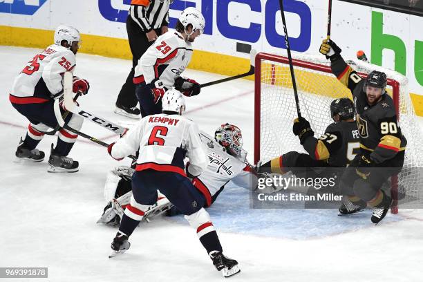 Tomas Tatar of the Vegas Golden Knights celebrates after assisting teammate David Perron on a second-period goal against Braden Holtby of the...