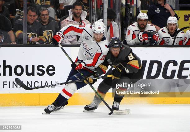 Lars Eller of the Washington Capitals and Jonathan Marchessault of the Vegas Golden Knights vie for the puck in the second period of Game Five of the...