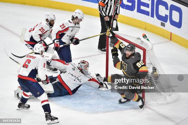 Tomas Tatar of the Vegas Golden Knights celebrates after scoring a goal against Braden Holtby, Michal Kempny, Devante Smith-Pelly and Christian Djoos...