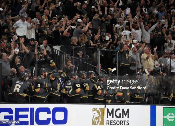 The Vegas Golden Knights celebrate a goal by teammate Nate Schmidt during the second period of Game Five of the 2018 NHL Stanley Cup Final against...