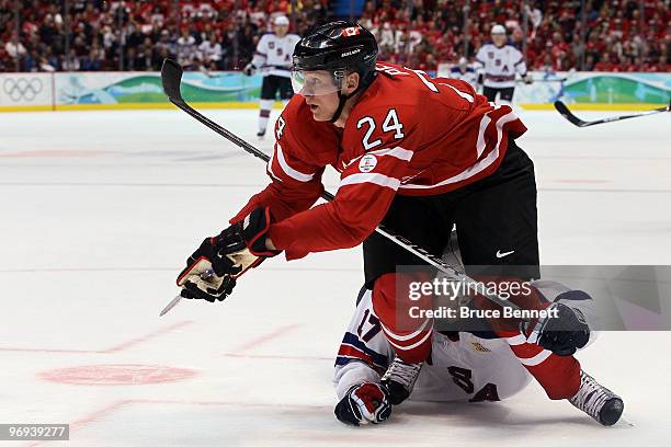 Corey Perry of Canada battles with Ryan Kesler of the United States during the ice hockey men's preliminary game between Canada and USA on day 10 of...