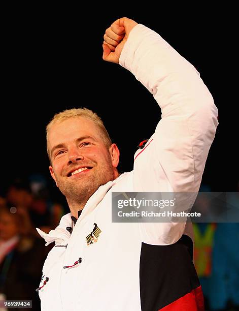 Germany 1's Andre Lange celebrates winning his fourth gold medal during the Two-Man Bobsleigh Heat 4 on day 10 of the 2010 Vancouver Winter Olympics...