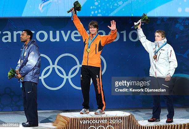 Shani Davis of United States celebrates his Silver medal, Mark Tuitert of Netherlands Gold and Havard Bokko of Norway Bronze during the medal...