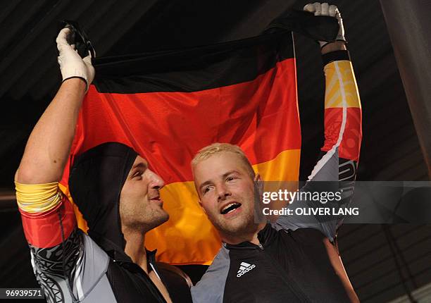 The German-1 two-man bobsleigh pilot Andre Lange and brakeman Kevin Kuske celebrate winning gold at the Whistler sliding centre during the Vancouver...