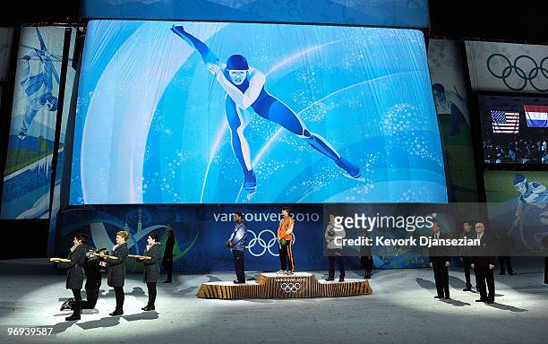 Shani Davis of United States celebrates his Silver medal, Mark Tuitert of Netherlands Gold and Havard Bokko of Norway Bronze during the medal...
