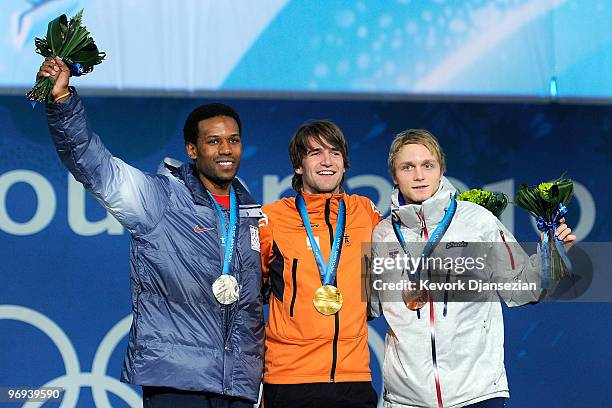 Shani Davis of United States celebrates his Silver medal, Mark Tuitert of Netherlands Gold and Havard Bokko of Norway Bronze during the medal...