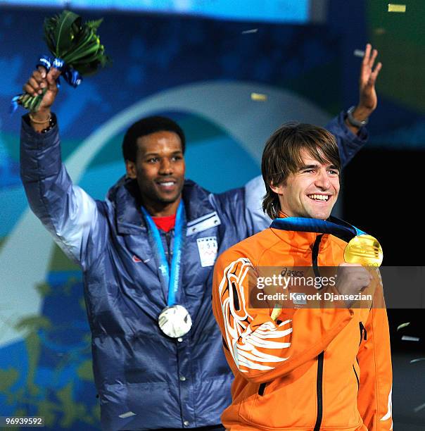 Mark Tuitert of Netherlands celebrates his Gold medal and Shani Davis of United States Silver during the medal ceremony for the Men�s 1500m Speed...