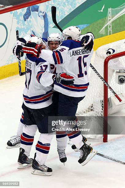 Zach Parise of the United States, Jamie Langenbrunner of the United States and Ryan Kesler of the United States celebrate after Kesler scored an...