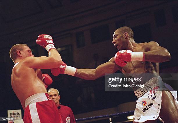 Johnny Nelson of England gets in a jab against Alexander Vassiliev during the WBU World Heavyweight Title match held at York Hall, in Bethnal Green,...