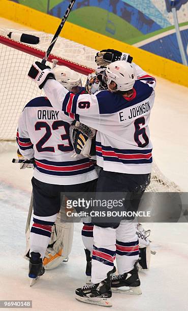 S forward Chris Drury , USA's defender Erik Johnson and USA's goalkeeper Jonathan Quick celebrate after a goal during the Men's preliminary Ice...