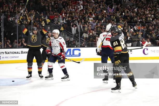 William Karlsson of the Vegas Golden Knights celebrates a goal by teammate Nate Schmidt during the second period against the Washington Capitalsin...