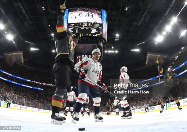 William Karlsson of the Vegas Golden Knights celebrates a goal by teammate Nate Schmidt during the second period against the Washington Capitalsin...