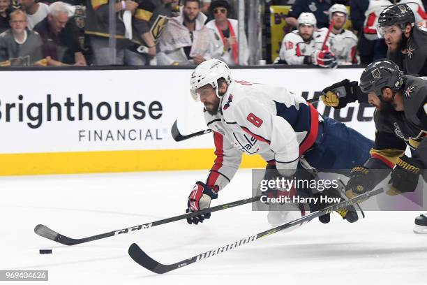 Alex Ovechkin of the Washington Capitals gets tripped up against the Vegas Golden Knights during the second period in Game Five of the 2018 NHL...