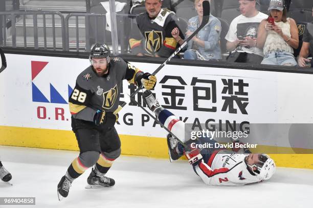 William Carrier of the Vegas Golden Knights checks Matt Niskanen of the Washington Capitals in Game Five of the Stanley Cup Final during the 2018 NHL...