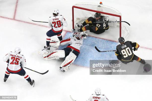 David Perron of the Vegas Golden Knights scores a second-period goal past Braden Holtby of the Washington Capitals as Christian Djoos defends in Game...