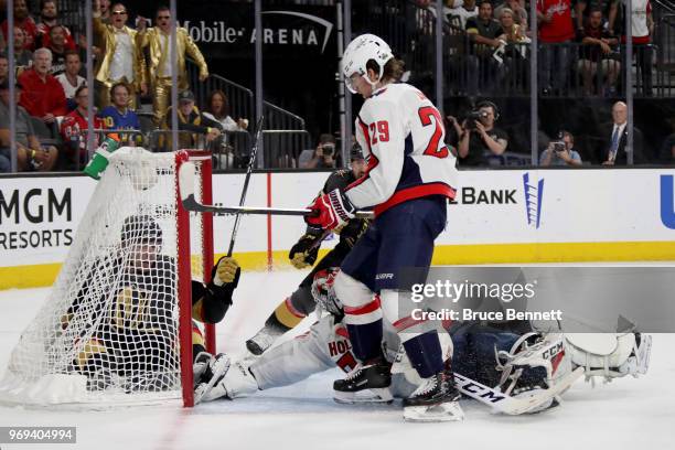 David Perron of the Vegas Golden Knights scores a second-period goal past Braden Holtby of the Washington Capitals as Christian Djoos defends in Game...