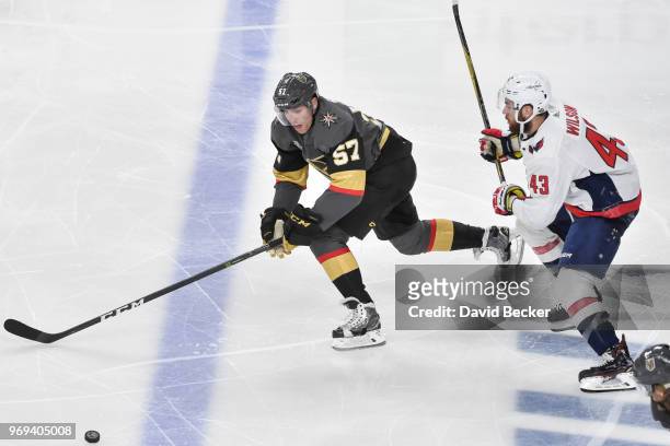 David Perron of the Vegas Golden Knights skates to the puck with Tom Wilson of the Washington Capitals defending in Game Five of the Stanley Cup...