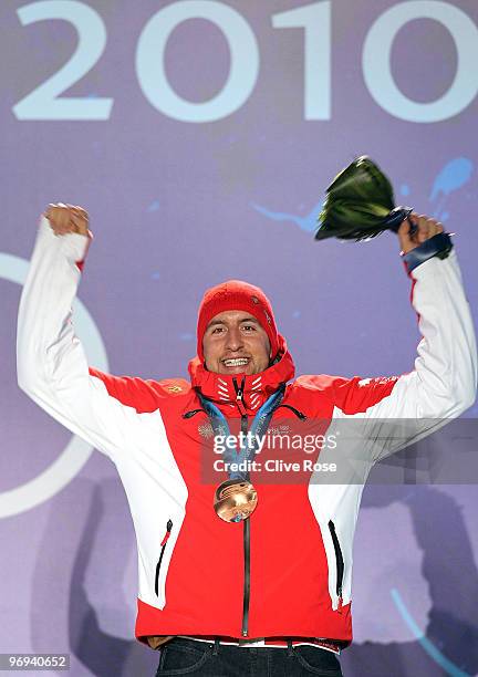 Silvan Zurbriggen of Switzerland celebrates his Bronze medal during the medal ceremony for the Men's Alpine Skiing Super Combined on day 10 of the...