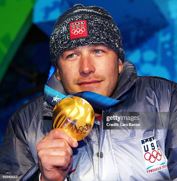 Bode Miller of the United States celebrates his Gold medal during the medal ceremony for the Men's Alpine Skiing Super Combined on day 10 of the...