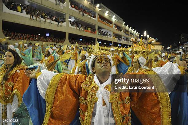 Members of Unidos da Tijuca Samba School dance during Rio de Janeiro's Carnival Champions Parade at Marques de Sapucai Sambodrome on February 21,...