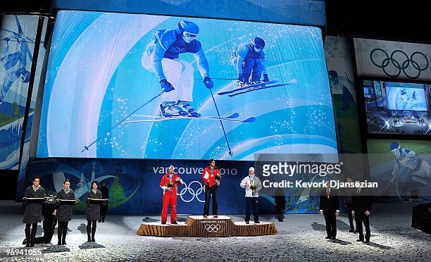 Andreas Matt of Austria celebrates his Silver medal, Michael Schmid of Switzerland Gold and Audun Groenvold of Norway Bronze during the medal...