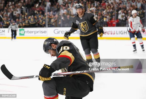 Tomas Tatar of the Vegas Golden Knights celebrates after deflecting the puck toward the net and off of teammate David Perron and into the net for a...