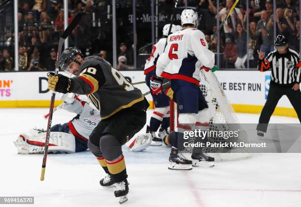 Tomas Tatar of the Vegas Golden Knights celebrates after deflecting the puck toward the net and off of teammate David Perron and into the net for a...