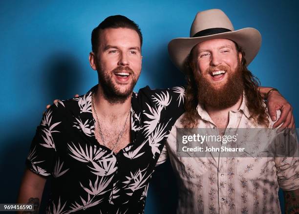 Osborne and John Osborne of Brothers Osborne pose in the portrait studio at the 2018 CMA Music Festival at Nissan Stadium on June 7, 2018 in...