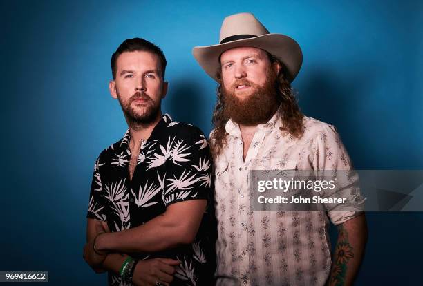 Osborne and John Osborne of Brothers Osborne pose in the portrait studio at the 2018 CMA Music Festival at Nissan Stadium on June 7, 2018 in...