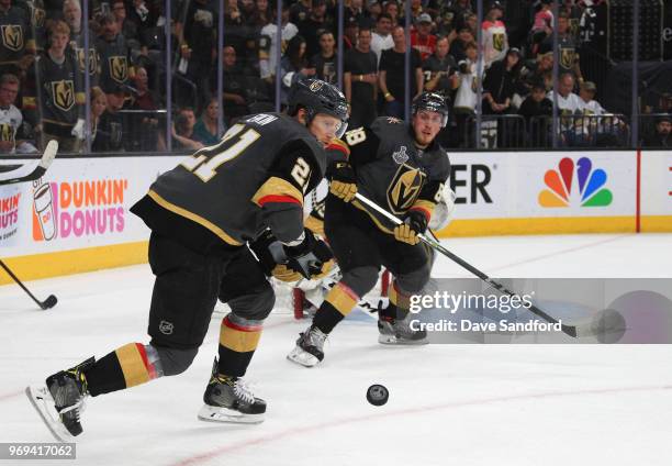 Cody Eakin and Nate Schmidt of the Vegas Golden Knights look to the puck in the second period during Game Five of the 2018 NHL Stanley Cup Final...