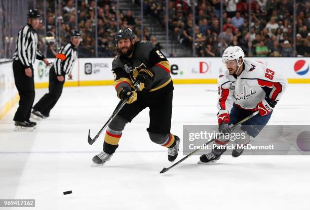 Deryk Engelland of the Vegas Golden Knights plays deep as Jay Beagle of the Washington Capitals pursues the play in the second priod of Game Five of...