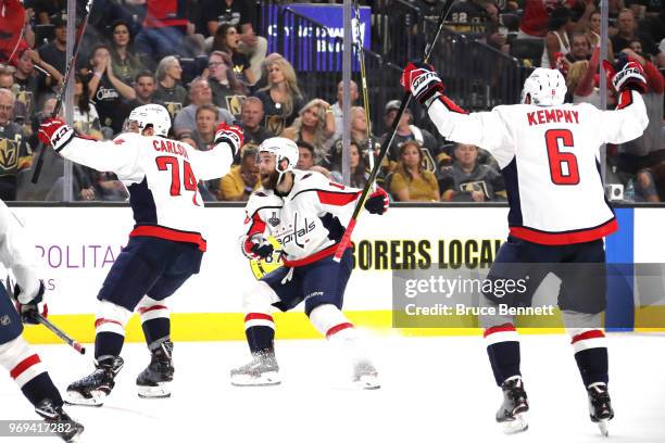 John Carlson, Brett Connolly and Michal Kempny of the Washington Capitals celebrate the third-period goal by teammate Lars Eller against the Vegas...