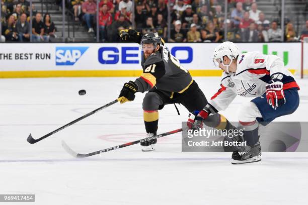 Jonathan Marchessault of the Vegas Golden Knights battles Dmitry Orlov of the Washington Capitals for the puck during the third period in Game Five...