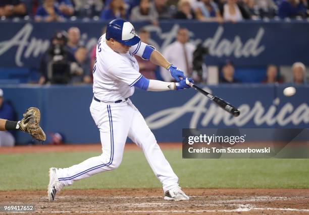 Aledmys Diaz of the Toronto Blue Jays hits a game-winning RBI single in the tenth inning during MLB game action against the Baltimore Orioles at...