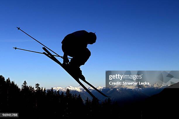 Skier takes a run during the men's ski cross race on day ten of the Vancouver 2010 Winter Olympics at Cypress Mountain Resort on February 21, 2010 in...