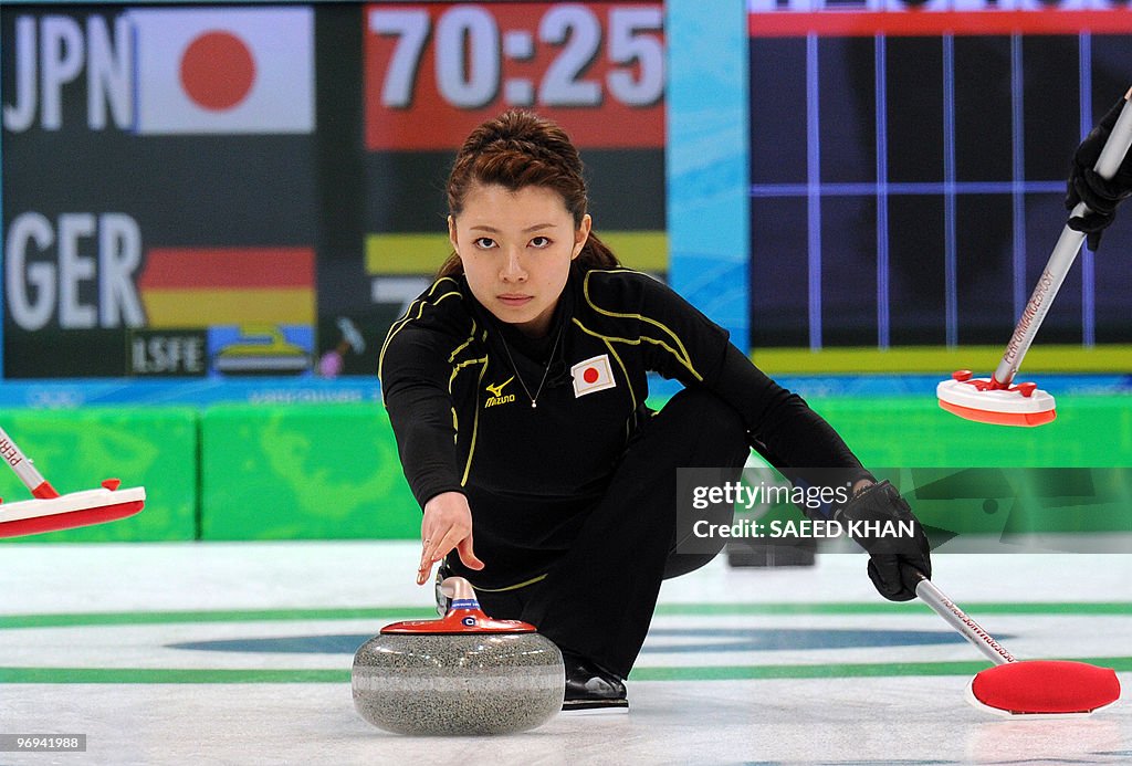 Japan's Mari Motohashi  releases a stone