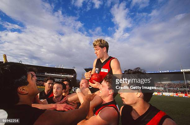 Mark Harvey of the Bombers is chaired off the ground following the round 22 match between Adelaide Crows and Essendon Bombers, 1997 in Melbourne,...