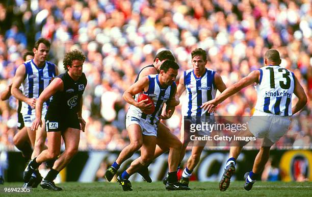 Peter Bell of the Kangaroos competes in the 1999 AFL Grand Final match between North Melbourne Kangaroos and Carlton Blues at the MCG on September...
