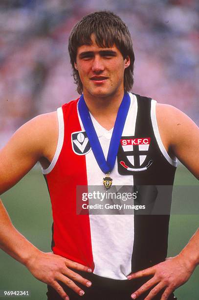 Tony Lockett of the St Kilda Saints poses with the 1987 VFL Coleman Medal, awarded to the highest goal kicker in a season, in Melbourne, Australia.