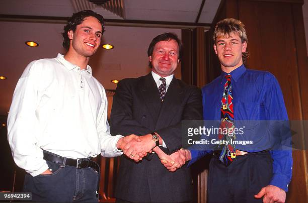 Gavin Wanganeen , and Mark Harvey of the Bombers, pose with coach Kevin Sheedy after the announcement of the 1993 All-Australian team in Melbourne,...