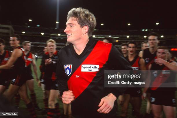 James Hird of the Bombers runs off the field following his 100th game during the round 11 AFL match between Essendon Bombers and Sydney Swans, 1998...