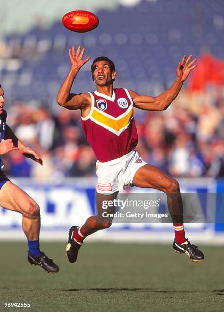 Gilbert McAdam of the Bears controls the ball during the round 19 AFL match between the Brisbane Bears and North Melbourne Kangaroos in Melbourne,...