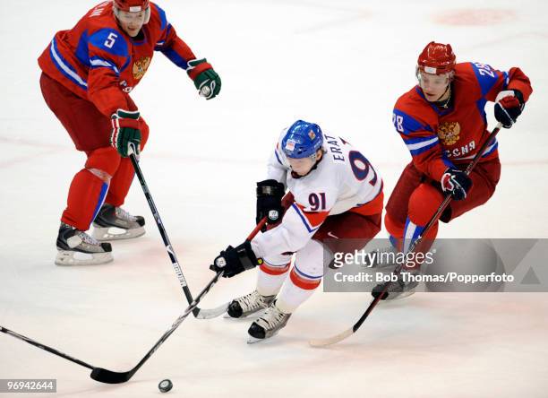 Martin Erat of the Czech Republic with Ilya Nikulin and Alexander Semin of Russia during the ice hockey men's preliminary game between Russia and...