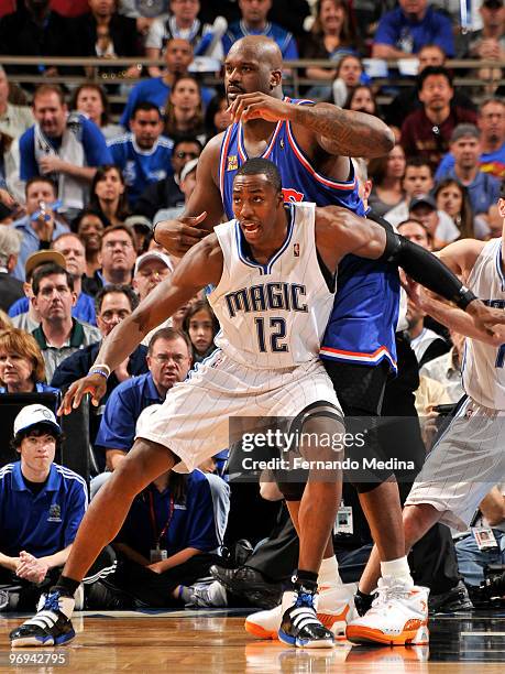 Dwight Howard of the Orlando Magic fronts Shaquille O'Neal of the Cleveland Cavaliers on defense during the game on February 21, 2010 at Amway Arena...