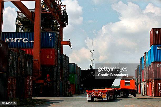 Shipping containers are stacked at Klong Toey Port's commercial shipment pier in Bangkok, Thailand, on Monday, Feb. 22, 2010. Thailand's economy...