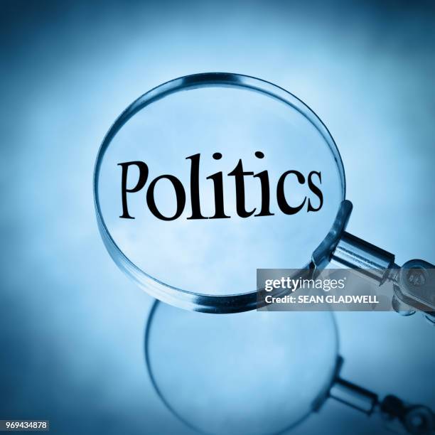 magnifying glass with the word politics - confidential englischer begriff stock-fotos und bilder