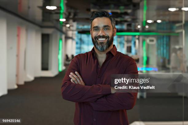 portrait of businessman inside high-tech office - male looking content stockfoto's en -beelden